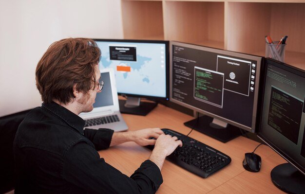 Home male-programmer-working-desktop-computer-with-many-monitors-office-software-develop-company-website-design-programming-coding-technologies-1040180-7096